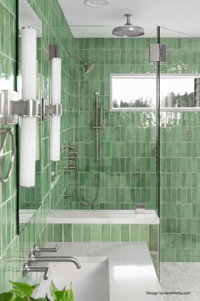 Green-tile bathroom with dual vanity and glass shower