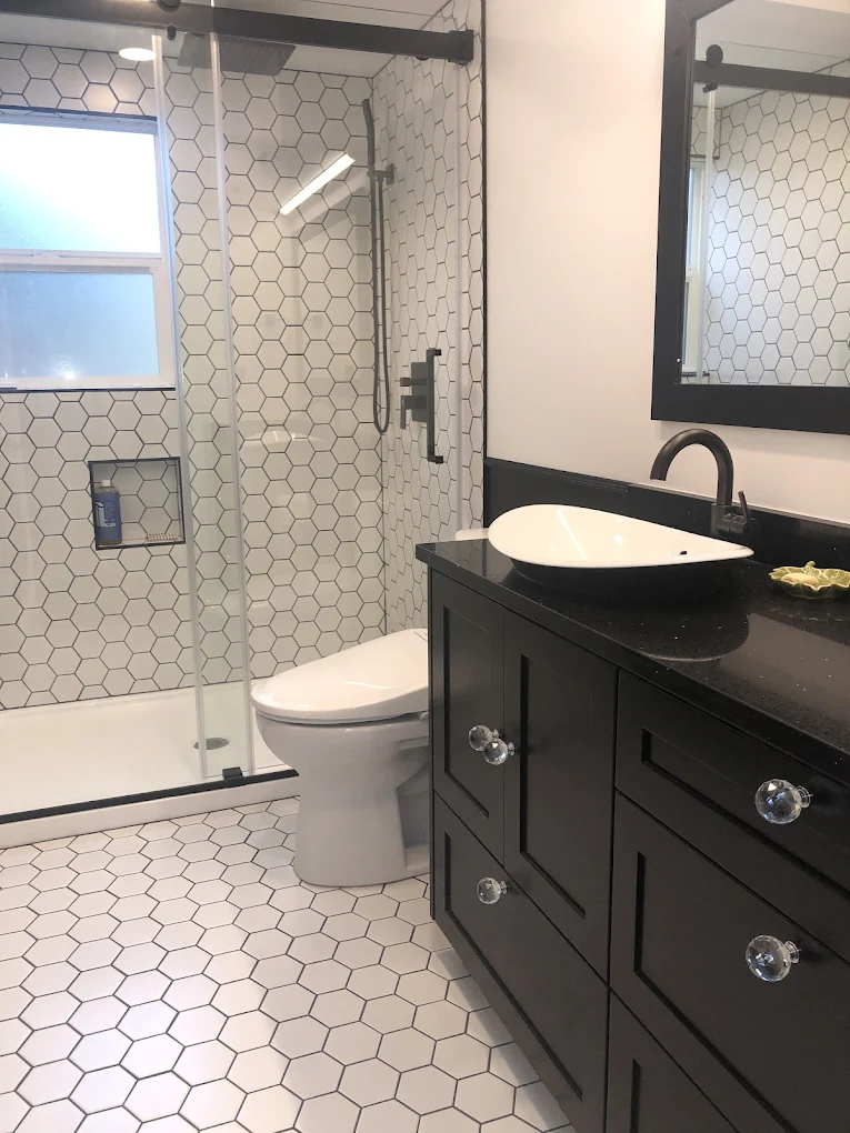 Hex-floor bath with black vanity