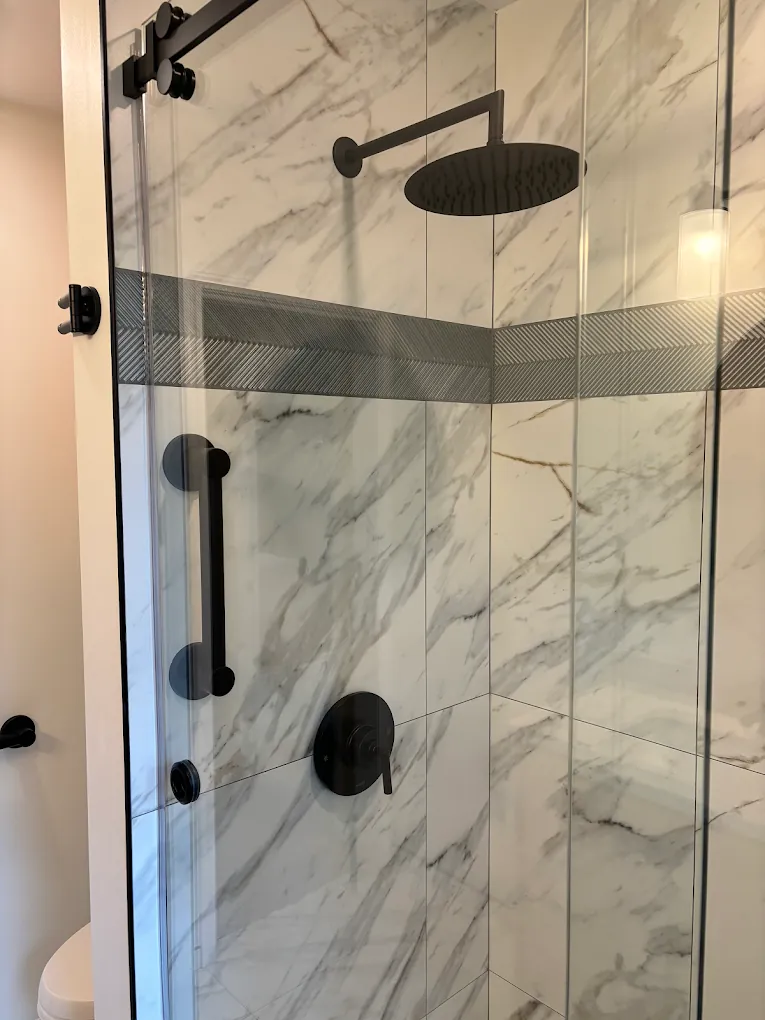 Marble shower with black fixtures