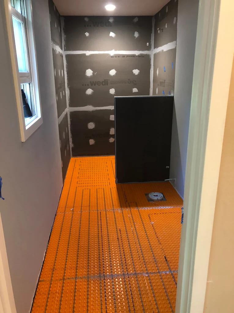 Bathroom shower in mid-construction with Wedi waterproofing