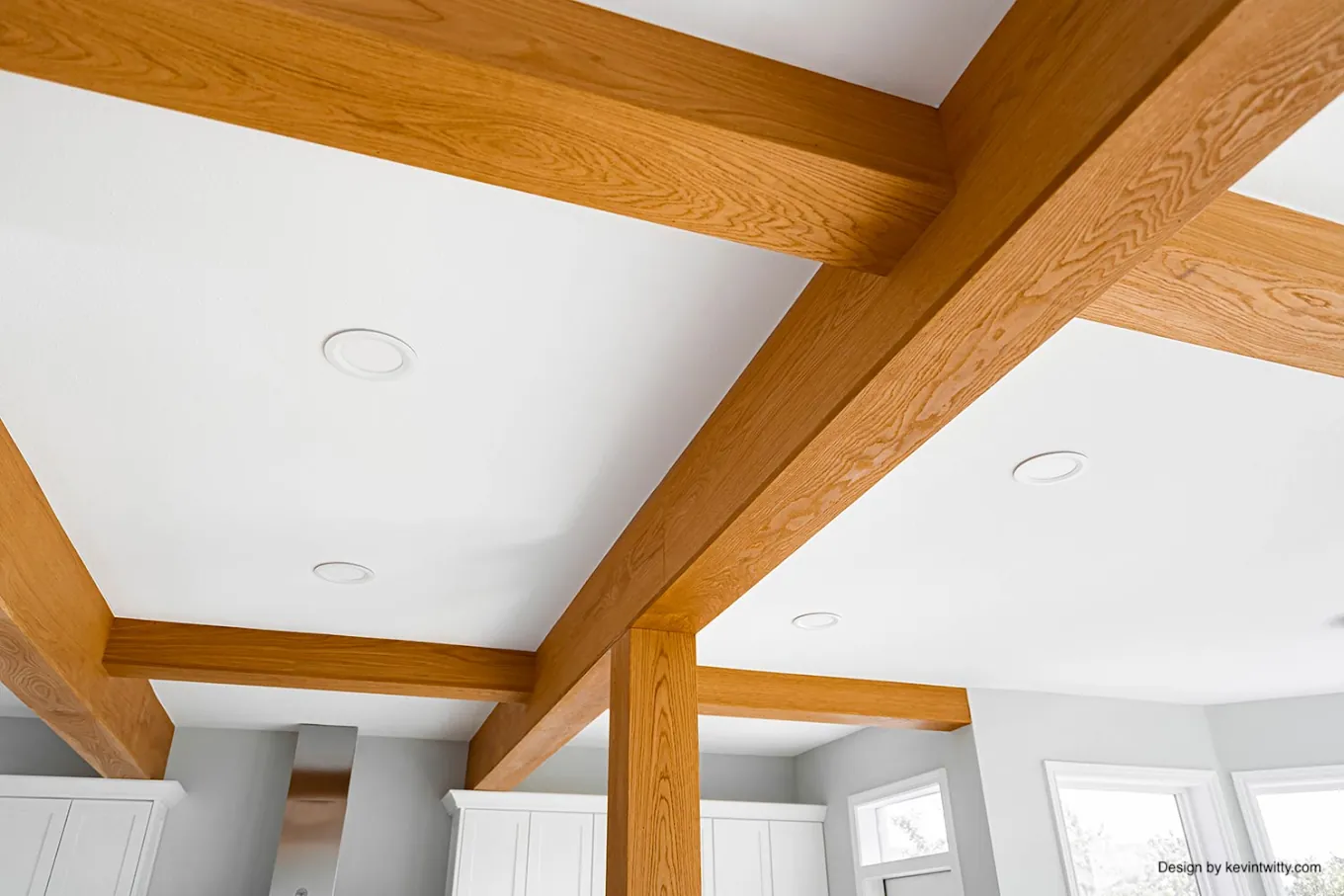 Wood beam ceiling detail against white walls