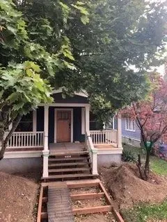 Bungalow exterior post-demolition, debris cleared